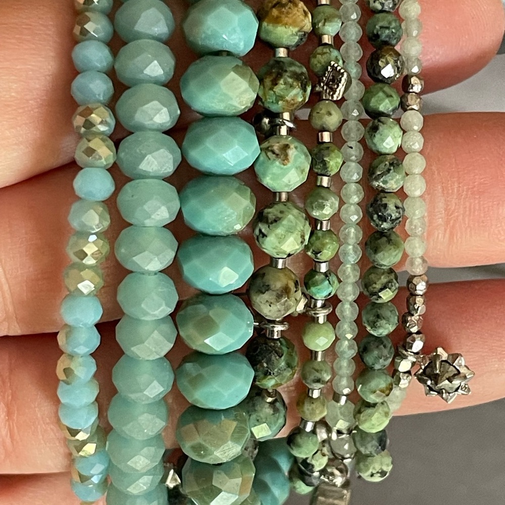 Multiple turquoise bracelets